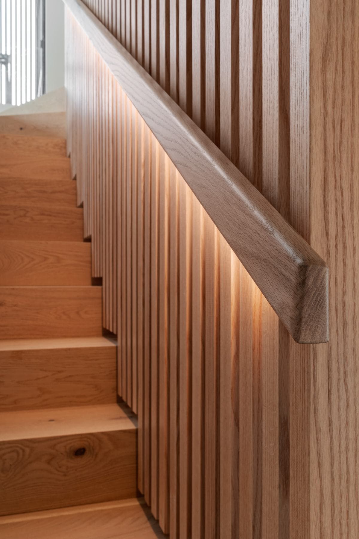 Oak stair detail in an airtight, well-insulated home built by Perrem
