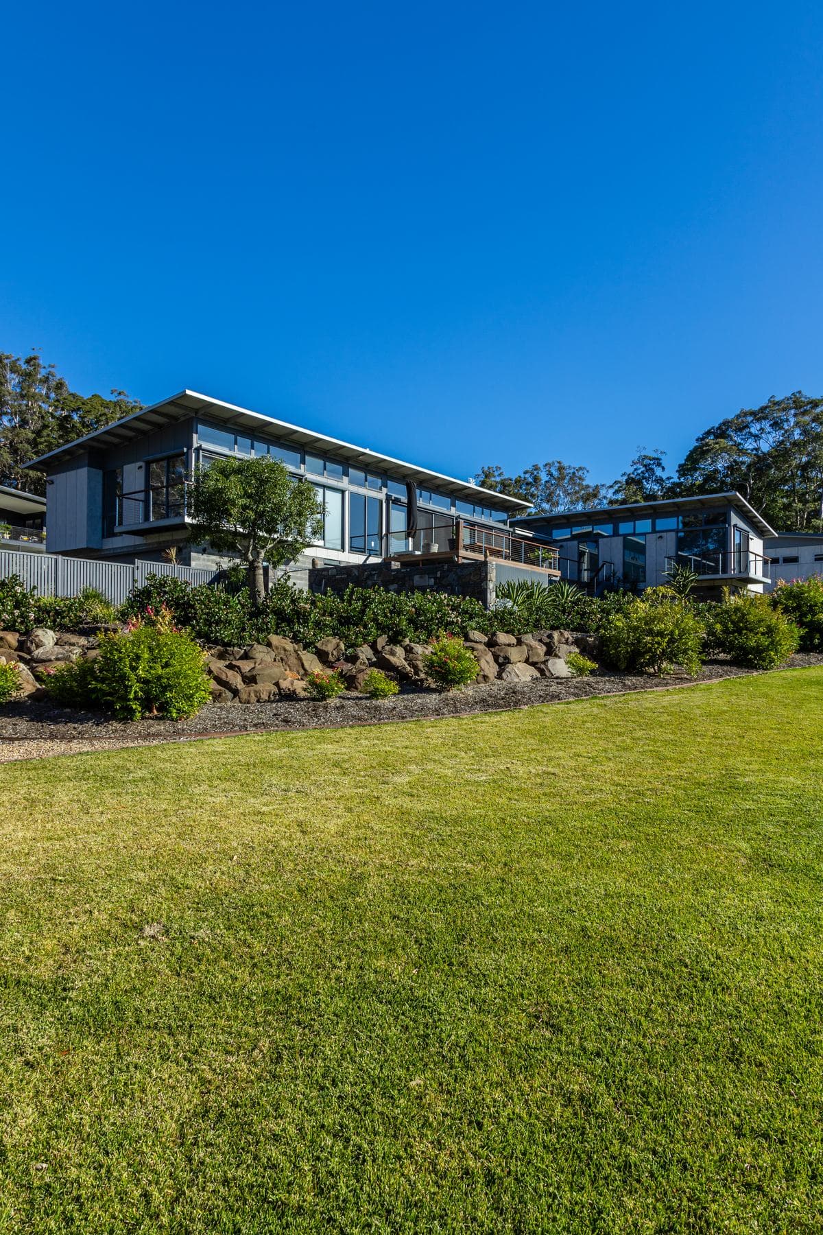 Sustainable coastal home with solar panels and native gardens, NSW South Coast